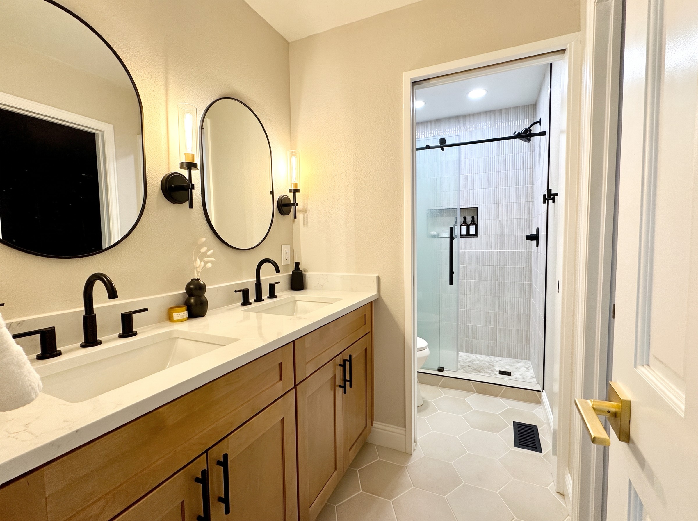 Modern double vanity and walk-in shower after Sinkovec Contracting remodel